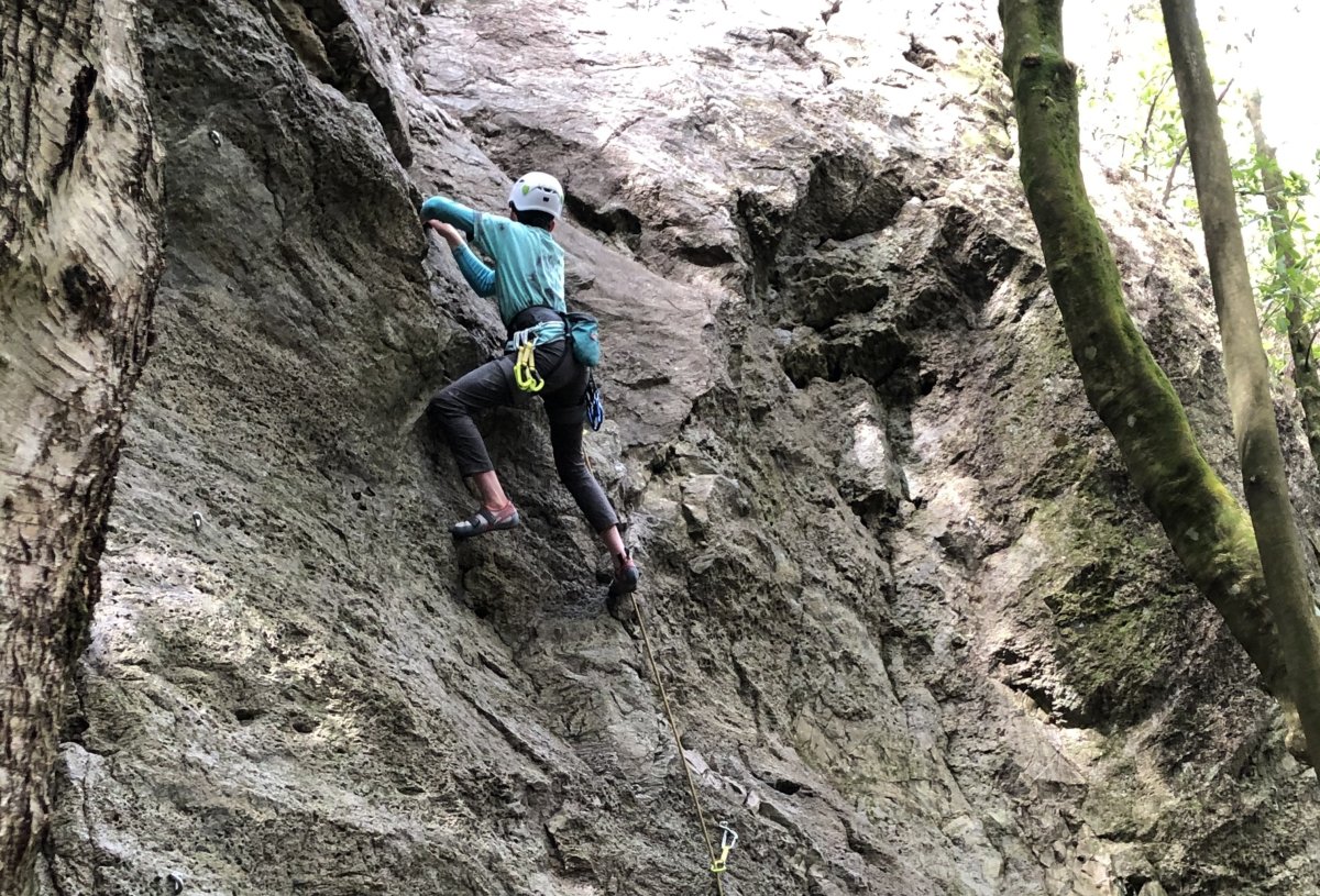 Climber in blue shirt at the Kinloch crag, Lake Taupō