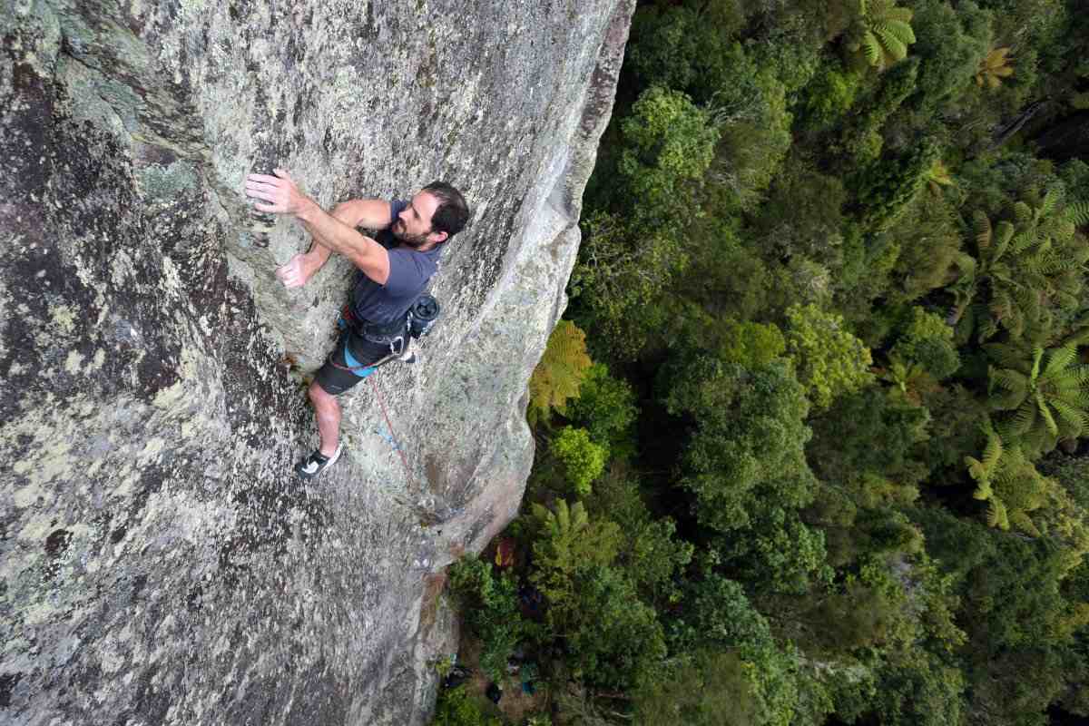 Kieran Liddicoat climbing Hot Lava, Whanganui Bay.