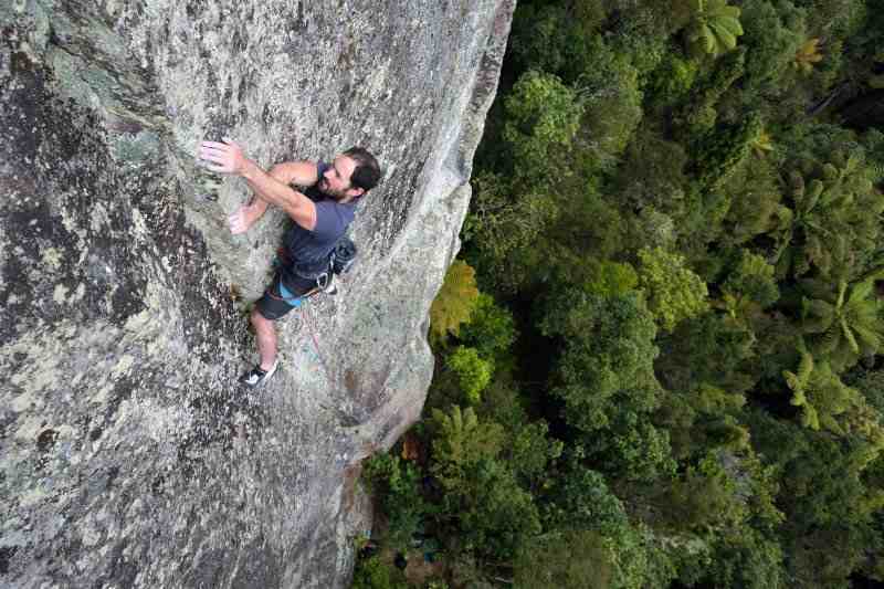 Kieran Liddicoat climbing Hot Lava, Whanganui Bay.